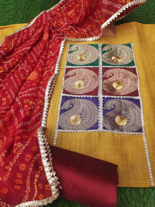 Mustard yellow raw silk designer suit with bandhej Dupatta