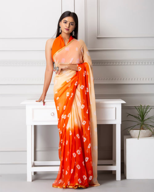 Cream with orange color bandhej print chiffon saree